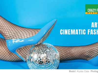 A pair of blue high heels on fishnet stockings next to a disco ball