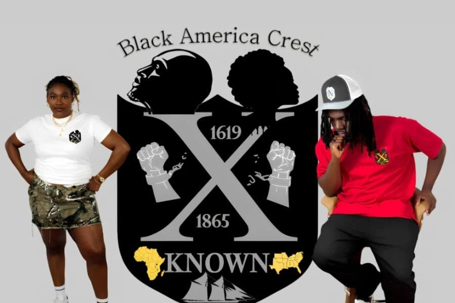 Two models dressed in X-Known clothing, standing in front of the brand’s logo that features the Black America Crest, showcasing a collaboration between fashion and culture.