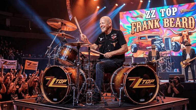 Drummer performing on stage with ZZ Top, energetic crowd and vibrant backdrop visible