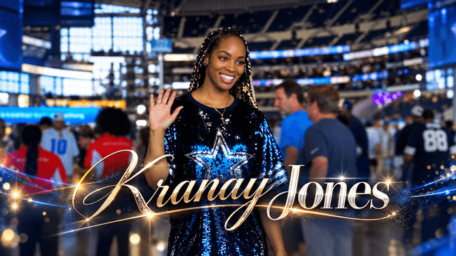 A smiling woman waves in a stadium, wearing a glittery outfit with a star design