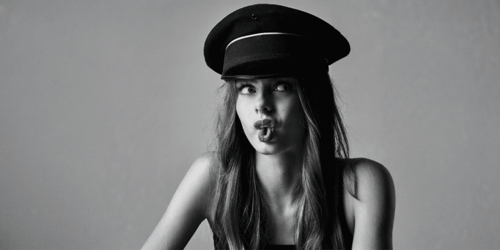 The Crisis of Self-Perception: Why Teenagers Are Struggling to Trust What’s Real "Black-and-white portrait of Nelly Opitz, a 15-year-old athlete and model, wearing a hat and striking a playful pose."